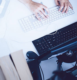 man types on the keyboard